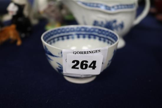 A Worcester blue and white sauceboat and a similar fisherman and cormorant teabowl c. 1770-90